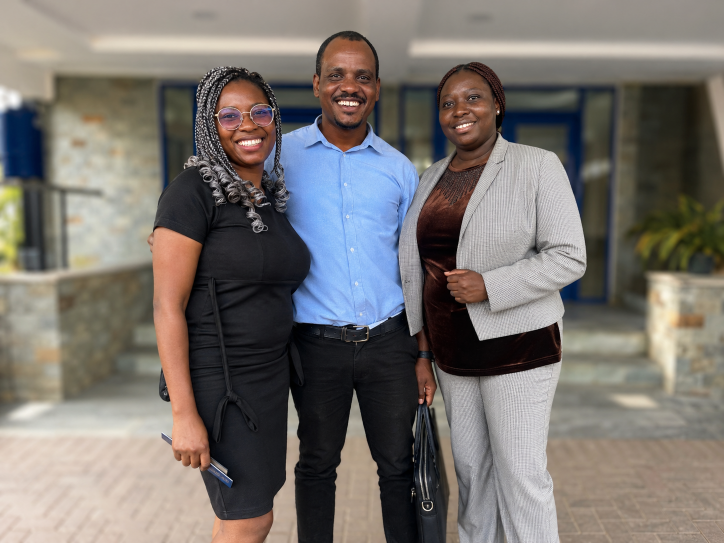 Officials of EcoBridge Ghana standing together as a team.